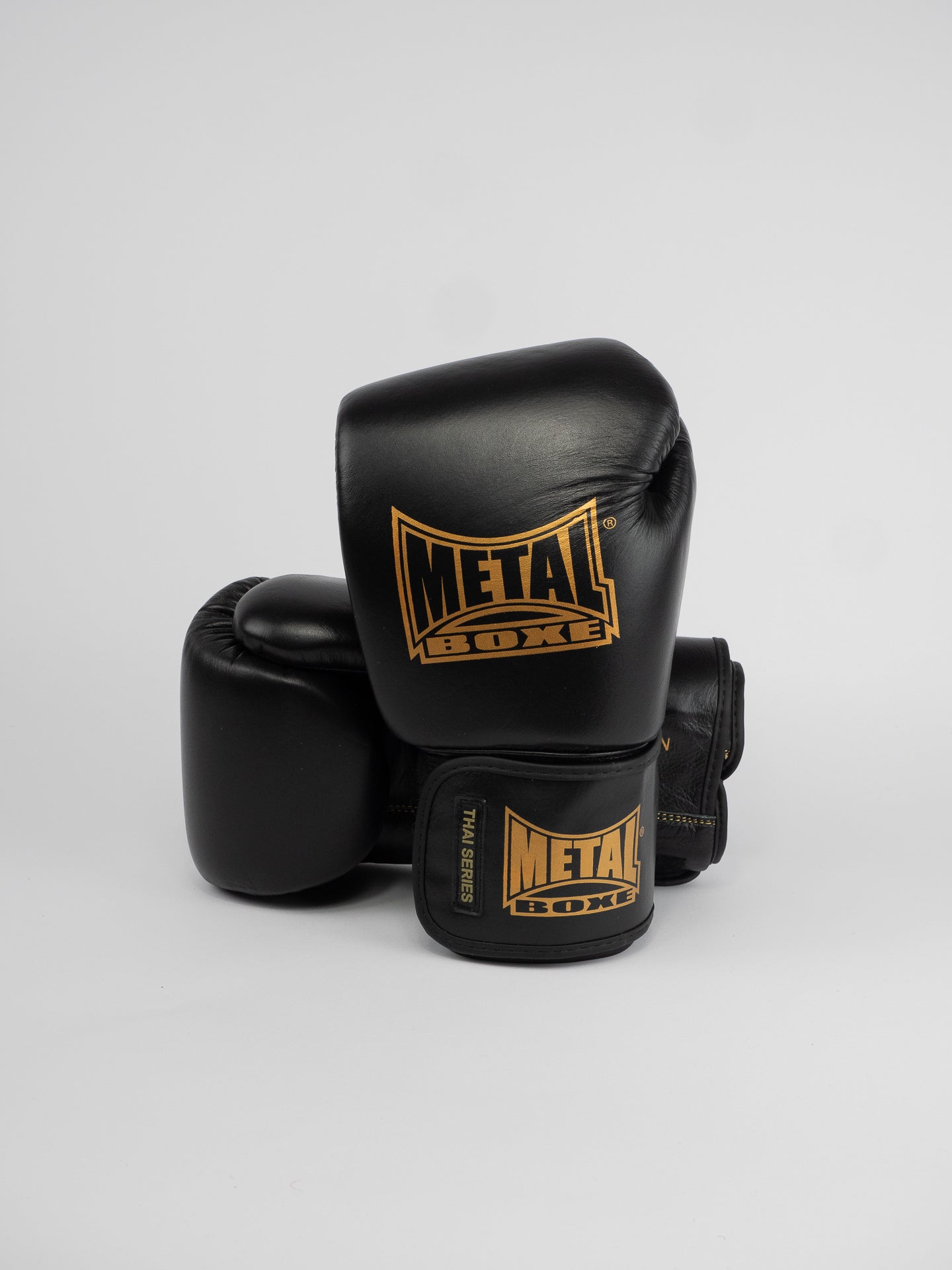 THAI SERIES BLACK GOLD LEATHER BOXING GLOVES
