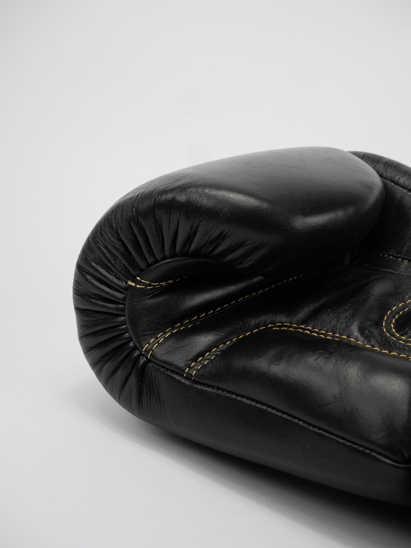 THAI SERIES BLACK GOLD LEATHER BOXING GLOVES