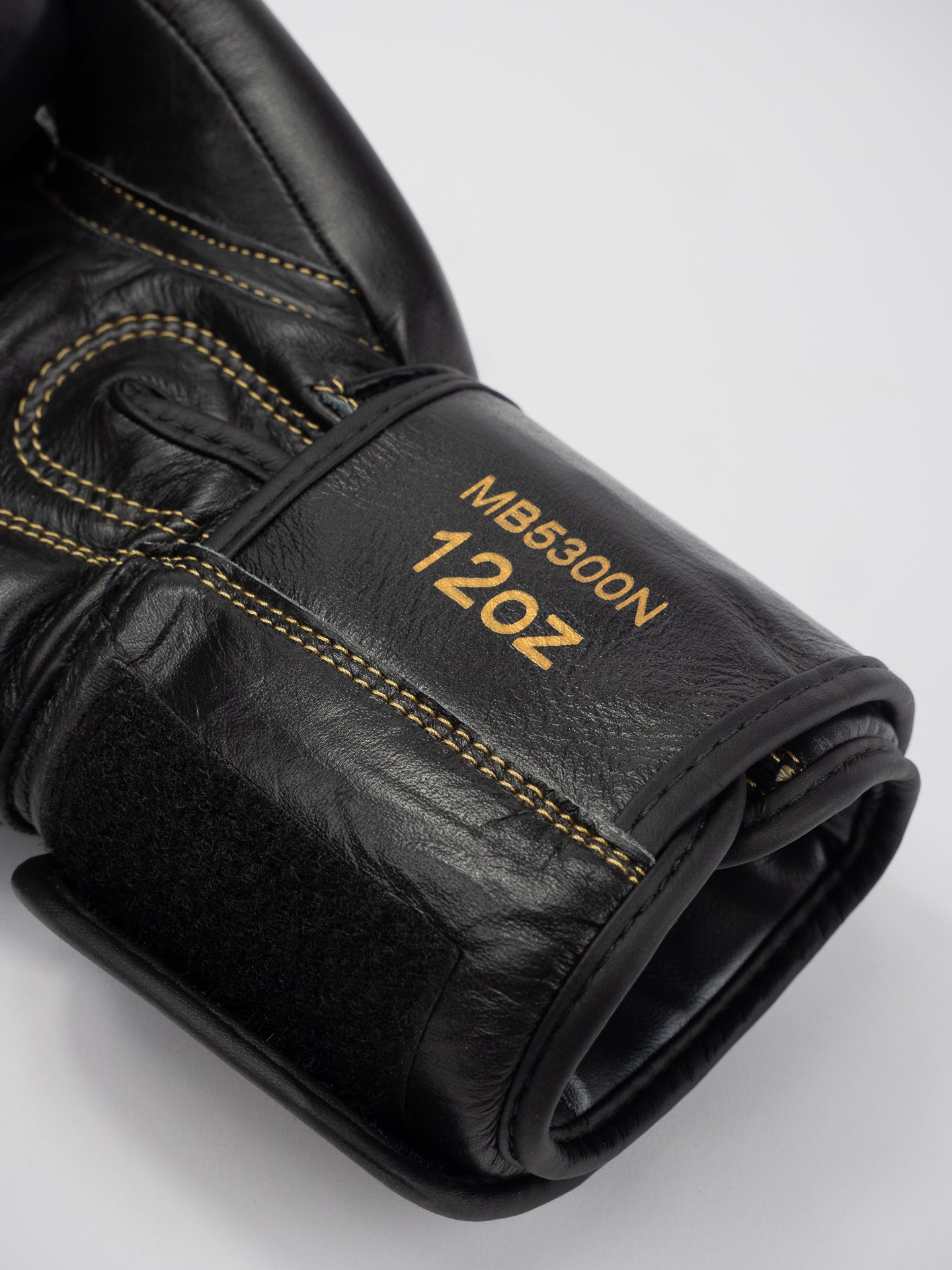 THAI SERIES BLACK GOLD LEATHER BOXING GLOVES