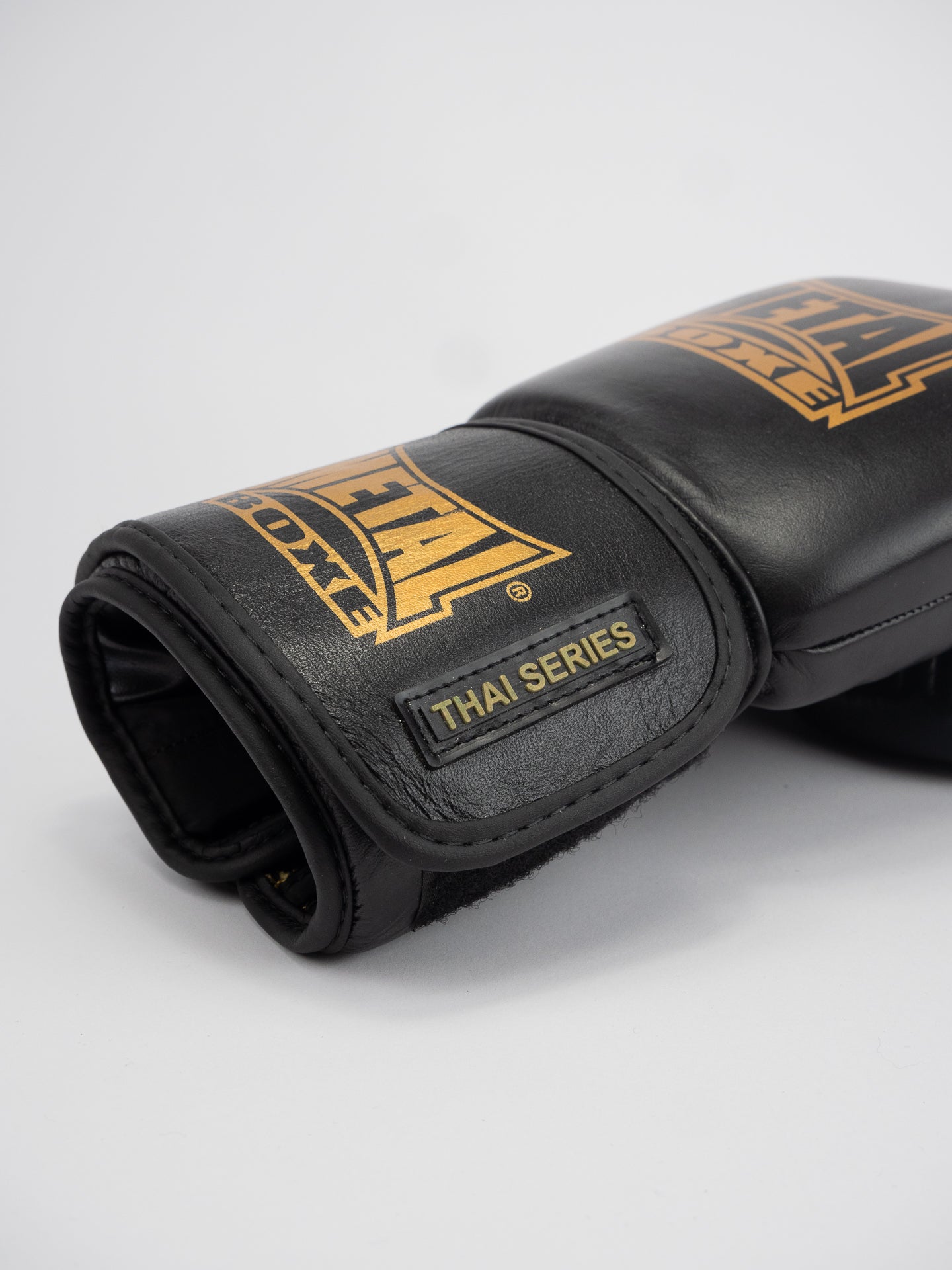 THAI SERIES BLACK GOLD LEATHER BOXING GLOVES